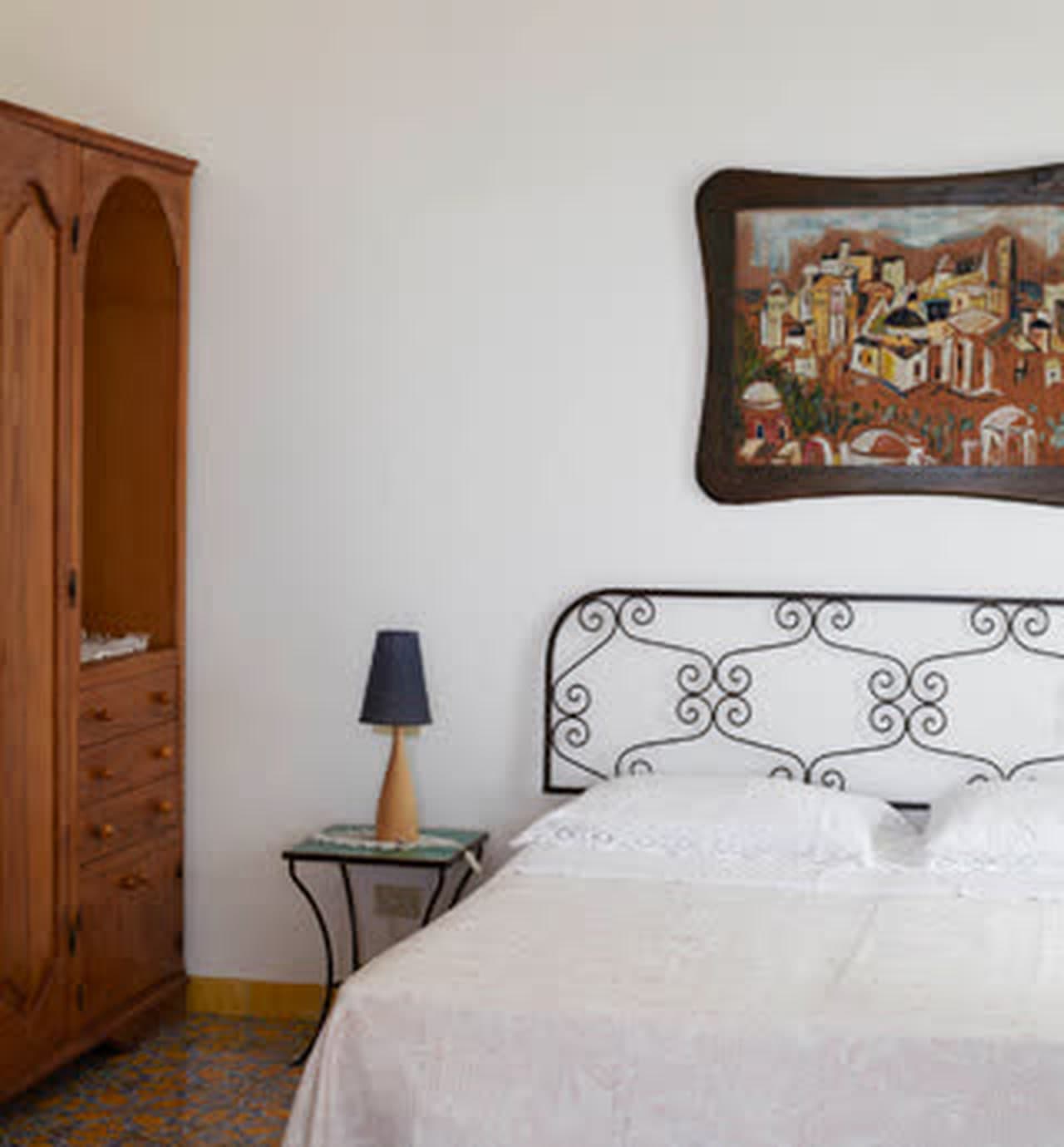 White walls and a vaulted ceiling in a guest room