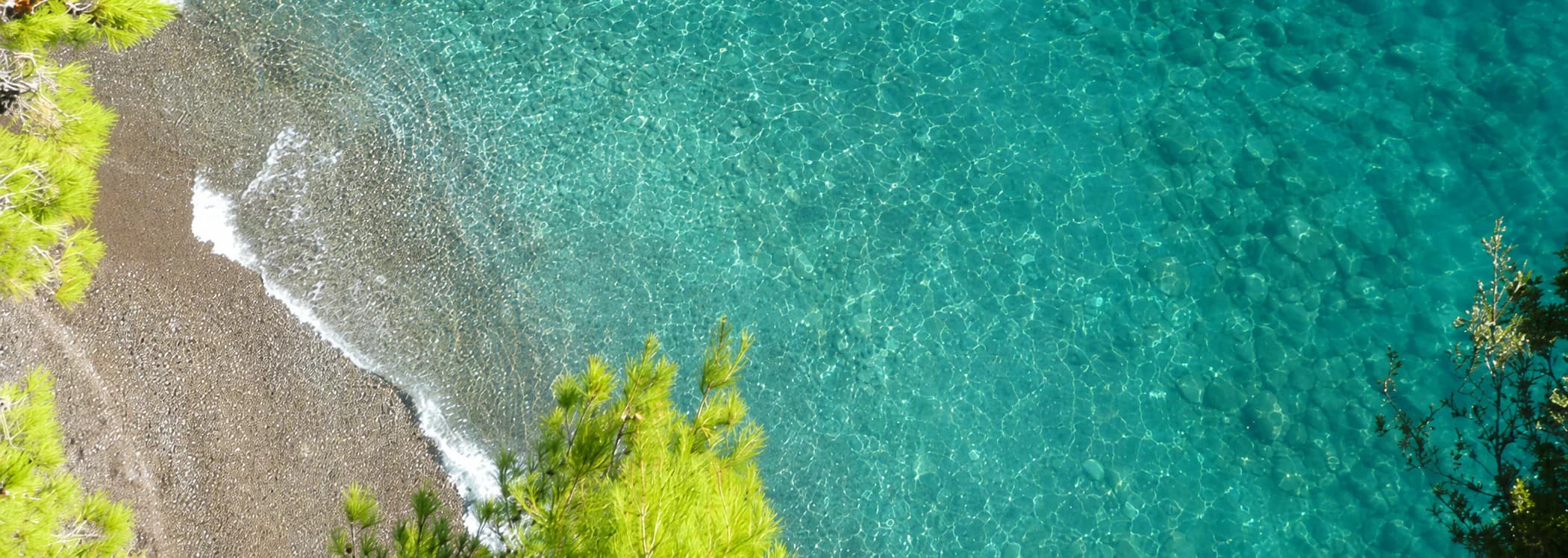 Clear water at La Fenice's private beach